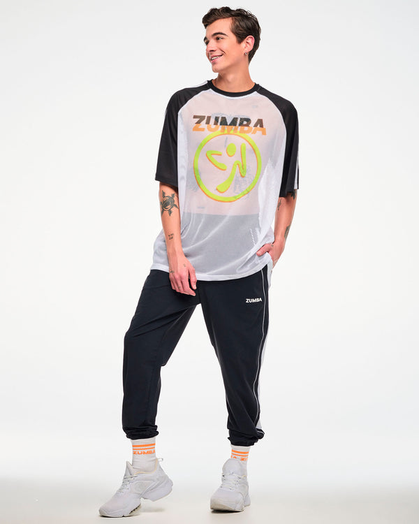 Male model, full view, wearing a white and black mesh tee with a yellow Zumbito logo, and