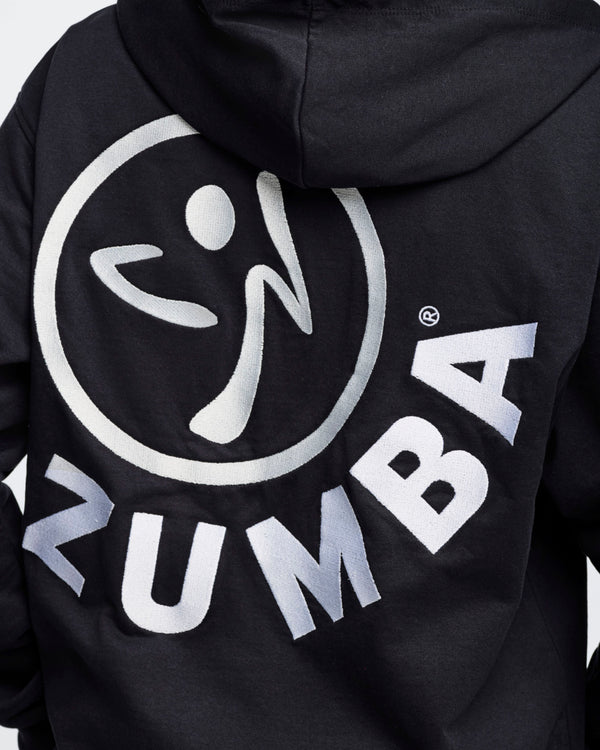 Close-up back view of a black hoodie featuring an embroidered white Zumbito logo with arched