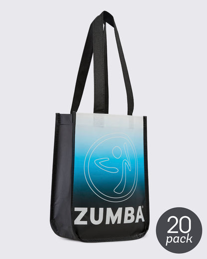 20 pack bag - Angled view of the reusable tote, showing the black side gusset next to the white-to-blue-to-black gradient front with the Zumbito and 'ZUMBA' text. 20 pack round sticker in grey in the lower right corner.