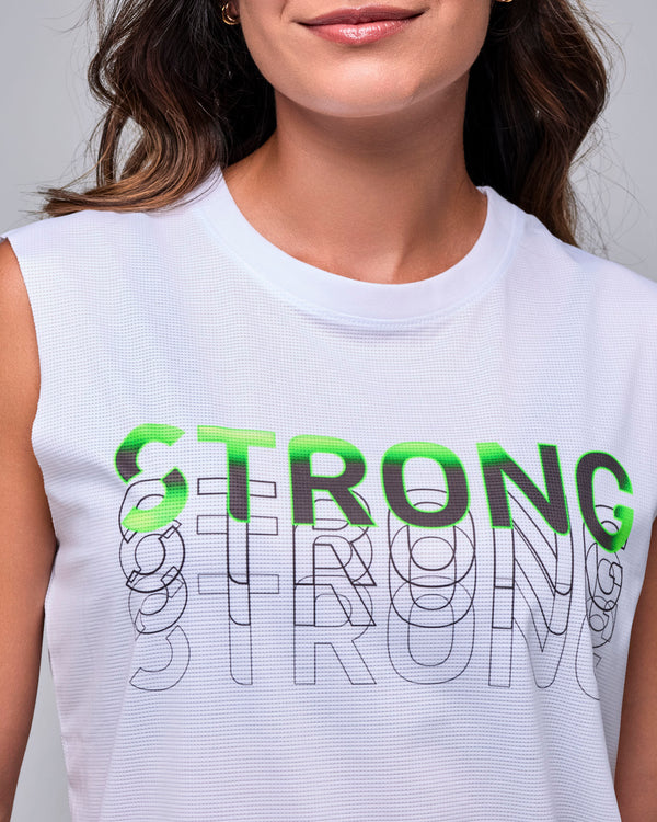 Close-up of the white mesh tank's crew neck and stacked 'STRONG' graphic, one line in neon green and black over repeated black outlines.
