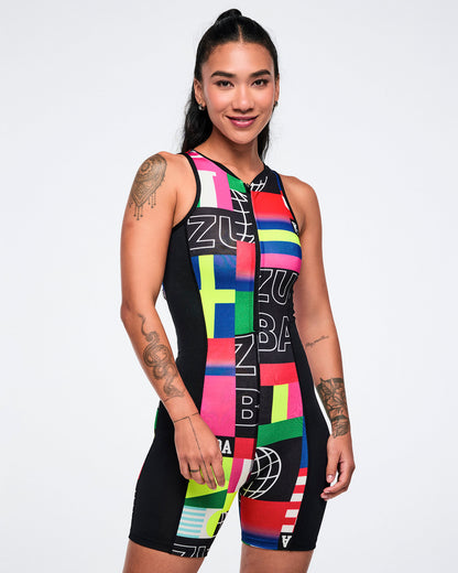 Female model wearing a colorful Zumba bodysuit on a white background.