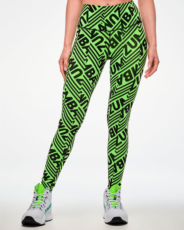 Female model wearing green leggings with a repeated black 