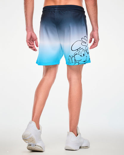 Back view of a male model in the navy-to-light-blue ombre mesh shorts, showing a large navy line drawing of a smiling Smurf peeking up with one hand raised on the right leg near the hem.