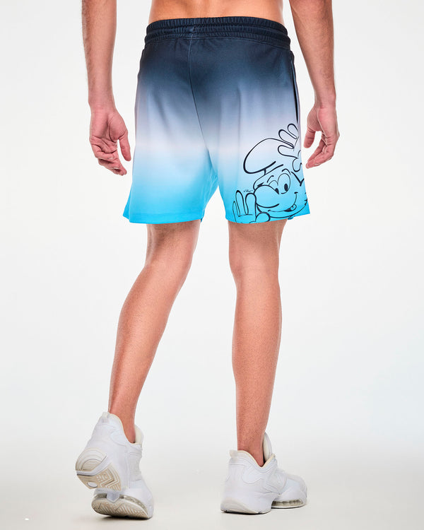 Back view of a male model in the navy-to-light-blue ombre mesh shorts, showing a large navy line drawing of a smiling Smurf peeking up with one hand raised on the right leg near the hem.