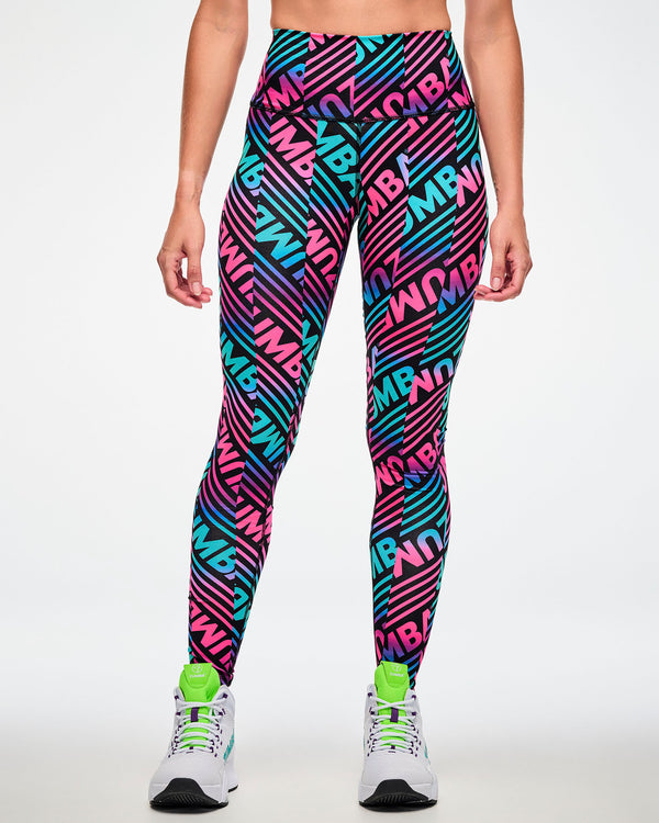 Female model wearing leggings with a bold pink, aqua, and black 