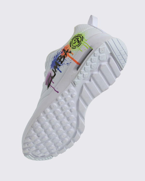 Angled view of a white Zumba sneaker with colorful design showing the patterned sole on a white background.