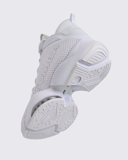 White Zumba high-top athletic sneaker shown from the bottom angle, highlighting the textured outsole tread, split sole design, and visible air cushioning under the mid foot.