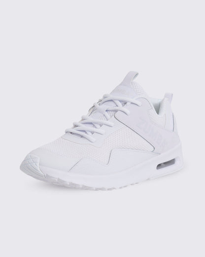 White Zumba low-top athletic sneaker in a front side view, featuring a mesh upper, tonal laces, layered synthetic overlays, embossed side branding, and a thick sole with visible air cushioning.