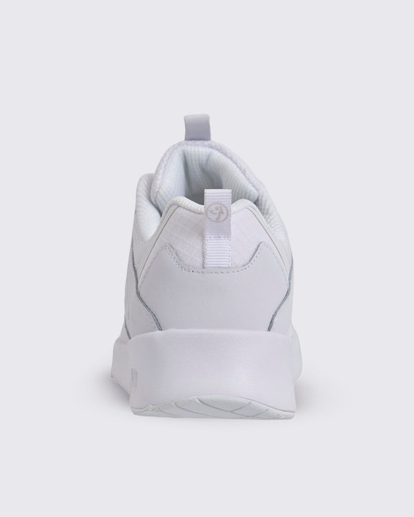 White Zumba low-top athletic sneaker shown from the back, featuring a padded collar, heel pull tab, smooth heel overlay, and chunky white sole.