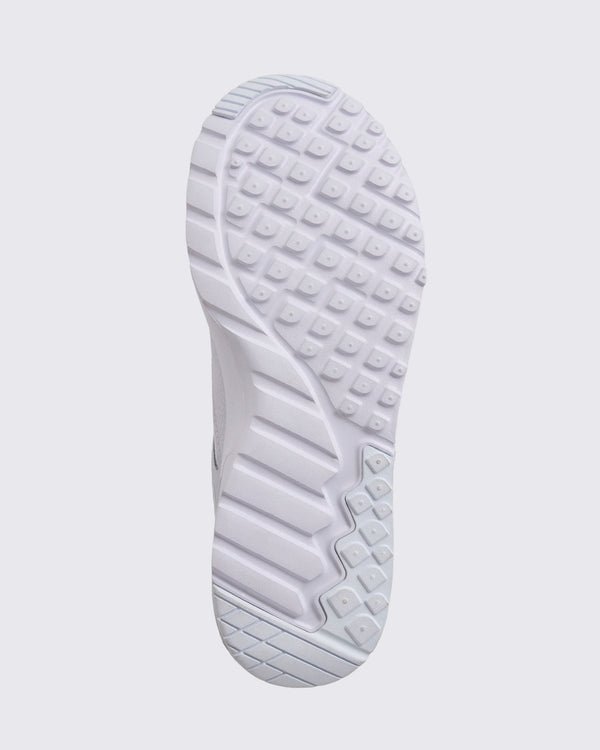 White Zumba sneaker outsole view, highlighting the full tread pattern with square grip lugs, flex grooves, and a cushioned sole.