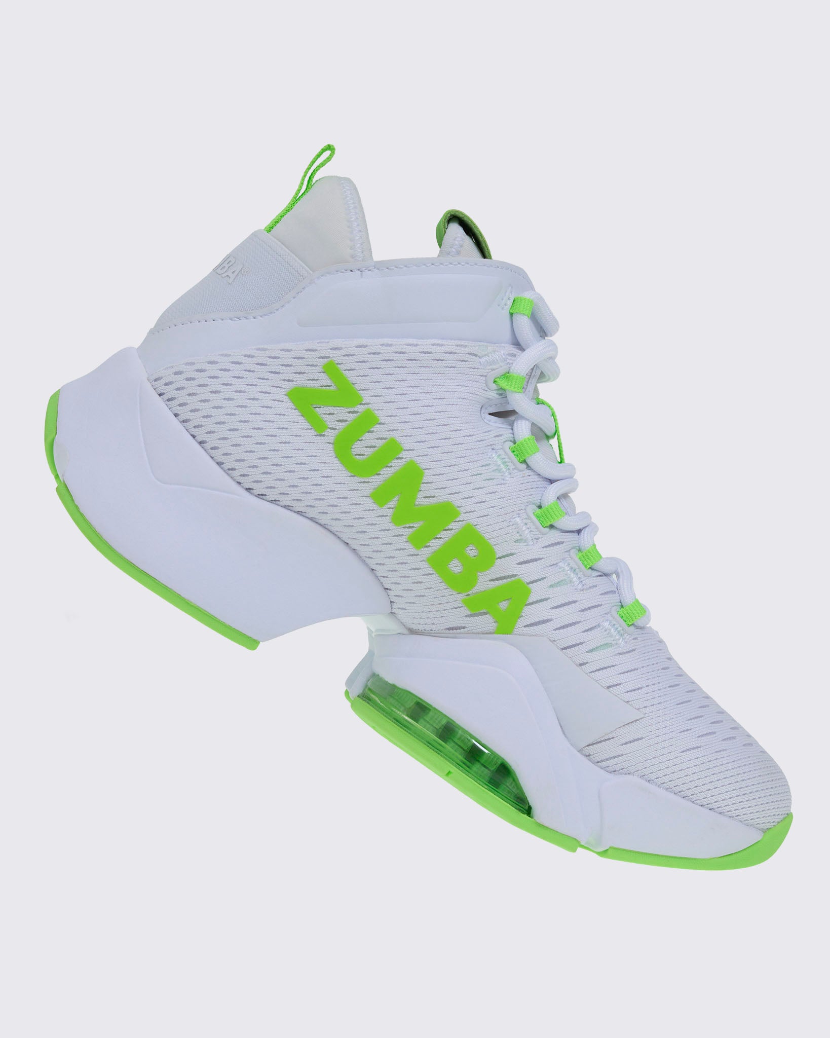 Right-side view of a white and green Zumba sneaker with “ZUMBA” in green, green-accented laces and sole, and a rear pull loop.