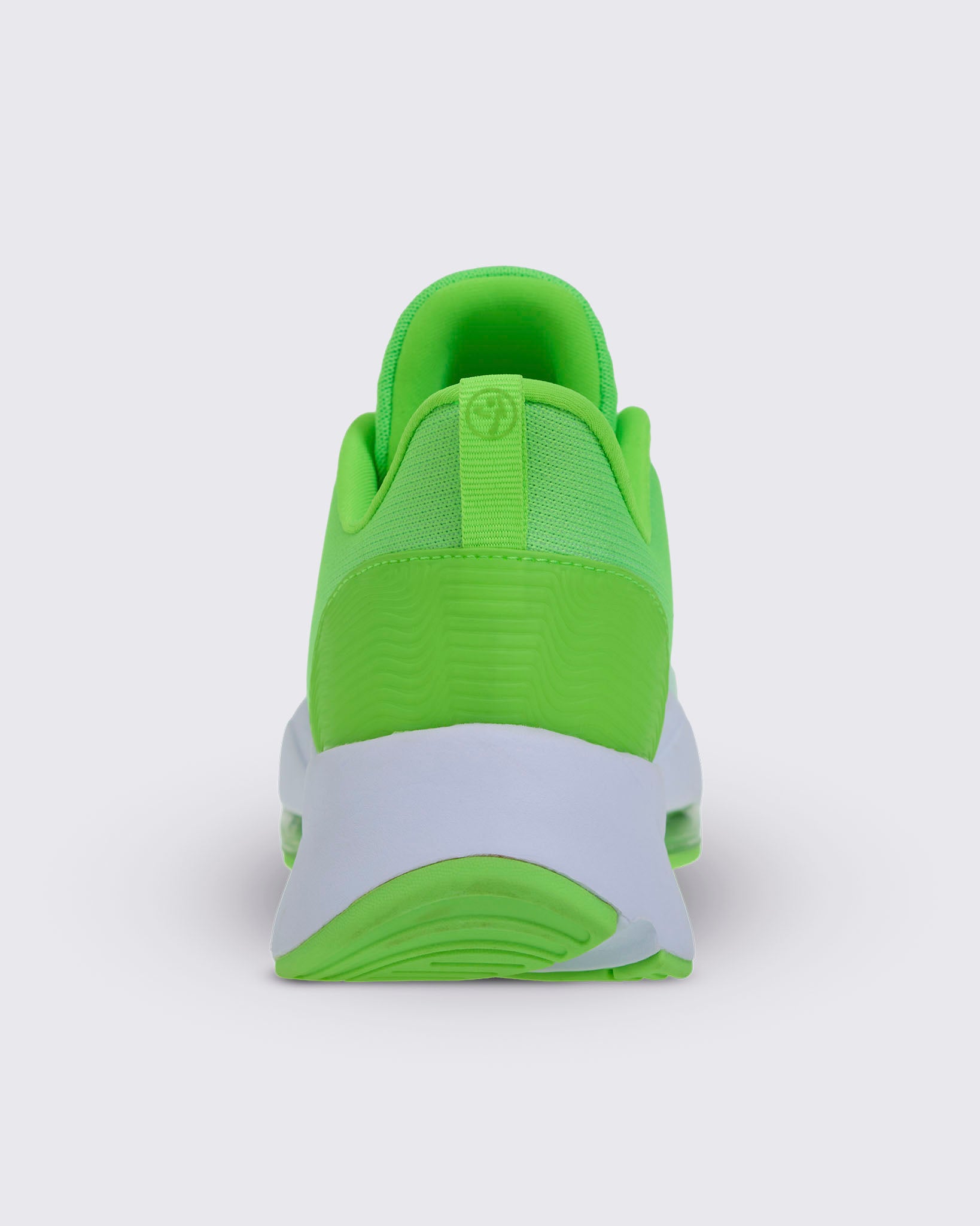 Heel view of a neon green sneaker with a fabric pull tab featuring a Zumbito logo, showing the white midsole and green sole.
