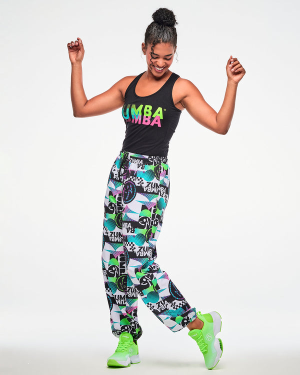 Female model wearing a black ribbed tank, paired with white multicolor 
