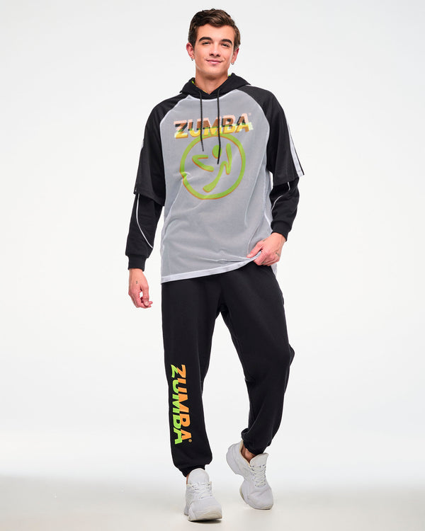 Male model wearing a white mesh tee with a big yellow and orange Zumbito logo and 
