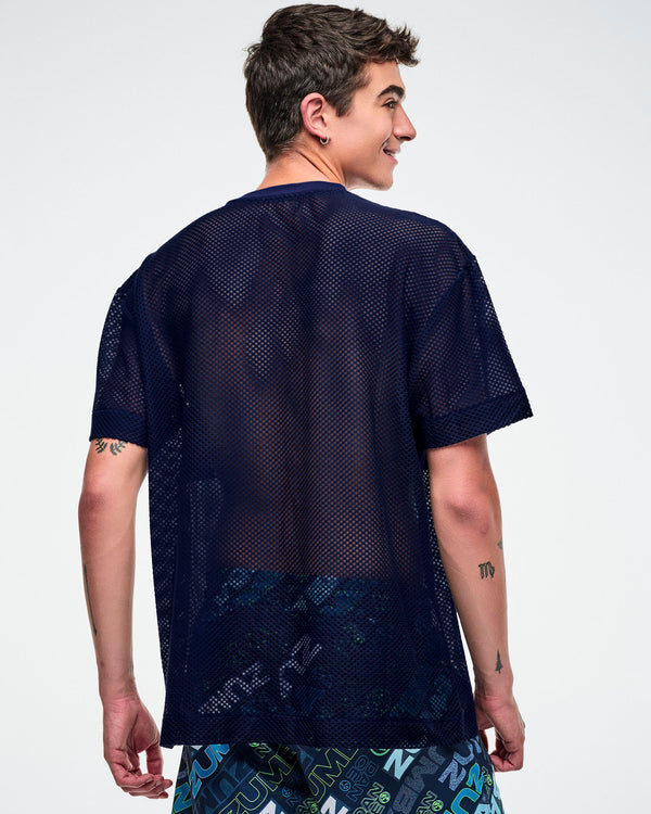 Back view of a male model wearing an indigo Zumba mesh top against a white background.