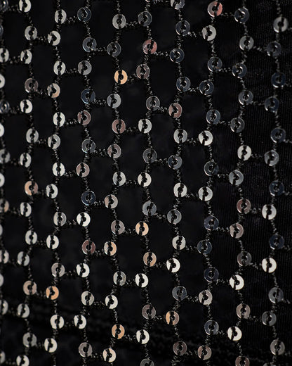 Close-up of the black sheer mesh panel with sequins, showing the chain-link pattern and the shimmering silver pattern.