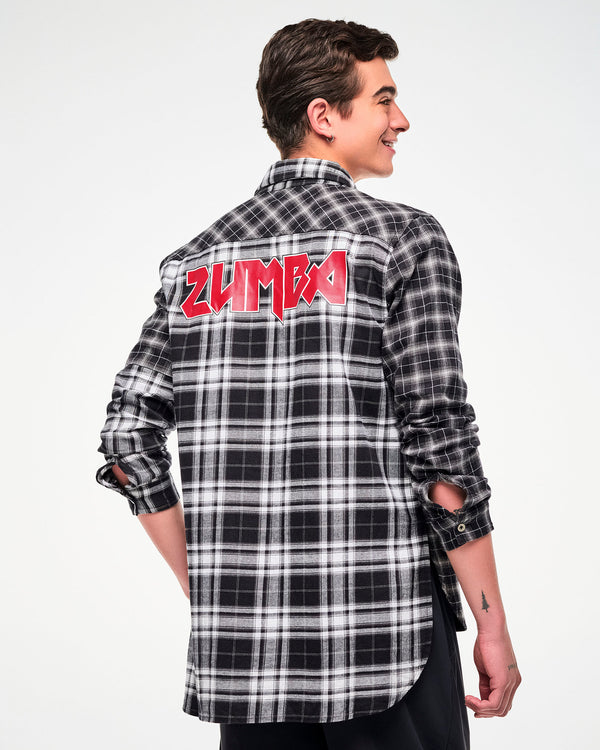 A male model shown from the back, wearing a black and white plaid button-down shirt with a red rock-like 'ZUMBA' text across the upper back.