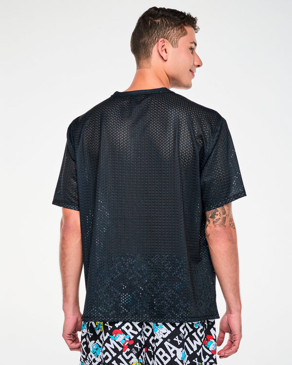 Back view of a male model in the black Smurfs mesh top, showing a plain back and dropped shoulders.