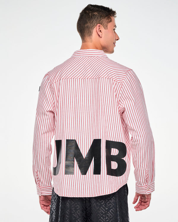 Back view of a male model in the red and white striped shirt, showing part of the black 'ZUMBA' lettering across the lower back and the buttoned cuffs.