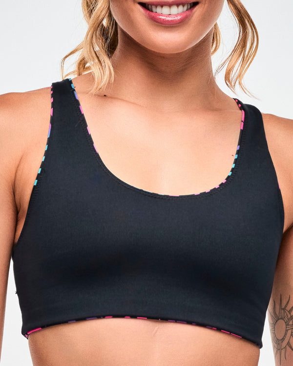 Close-up of the reverse of the solid Electric Feel Z-Lift Scoop Bra in black with the the aqua and pink showing as a trim affect.