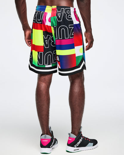 Back view of a male model wearing colorful athletic shorts with a brand logo on a white background.