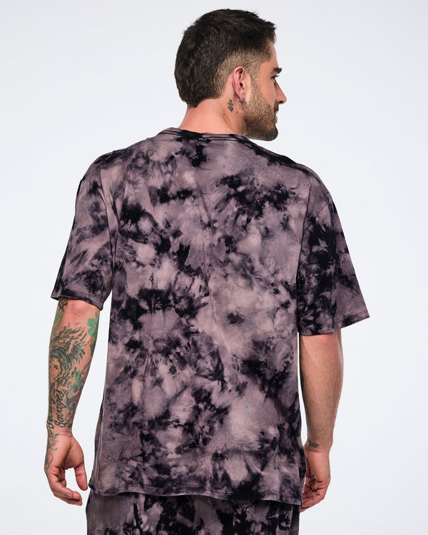 Oversized black and tan tie-dye Zumba T-shirt shown from the back with matching tie-dye jogger pants. Male model wears the loose-fit short-sleeve crewneck tee with coordinating joggers.