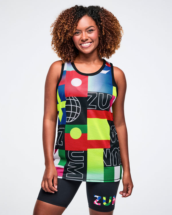 Female model wearing a colorful athletic tank top with geometric patterns and text on a white background.