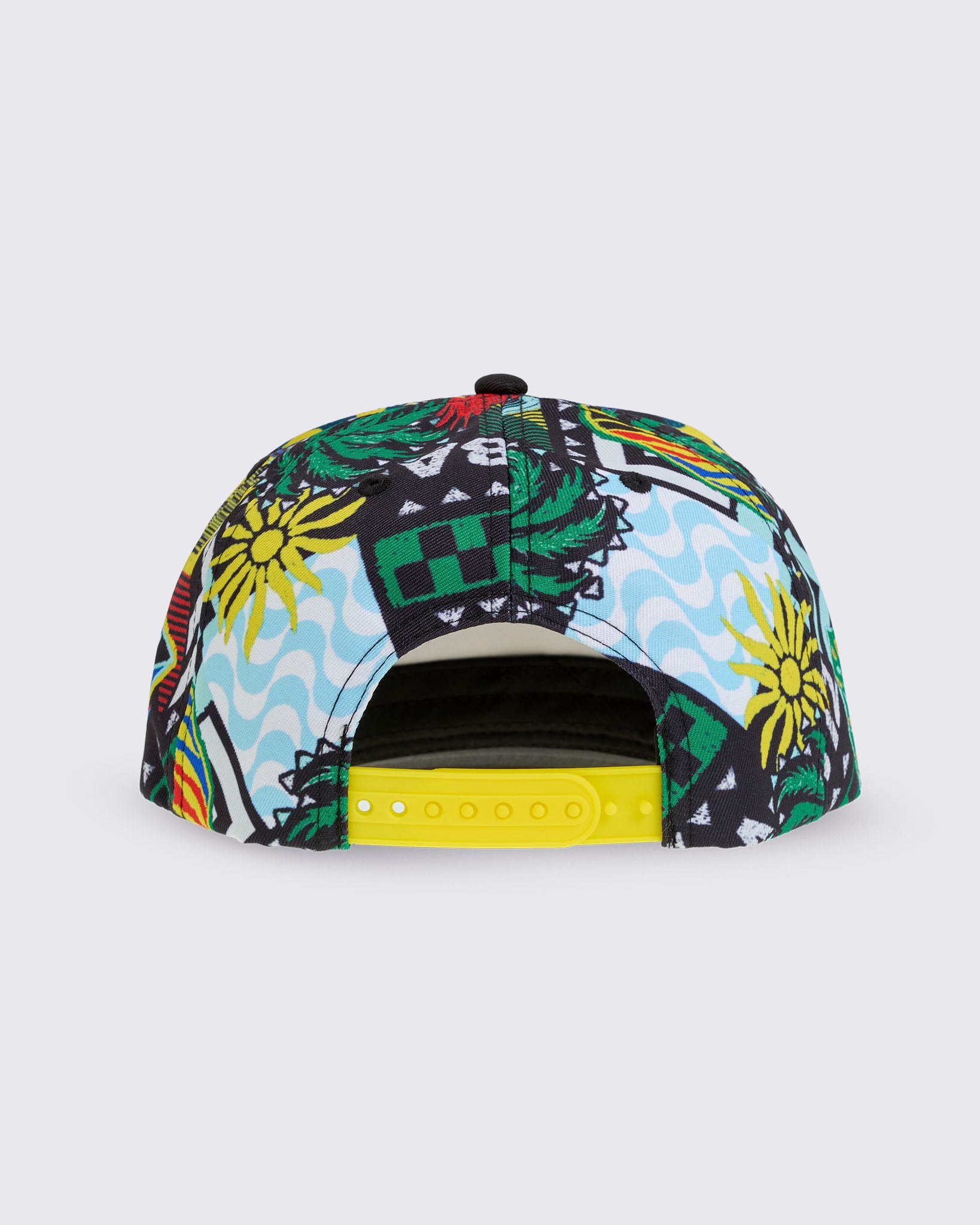 Product-only back view of the cap, showing the open back with a bright yellow snapback strap and the tropical-print panels wrapping around.