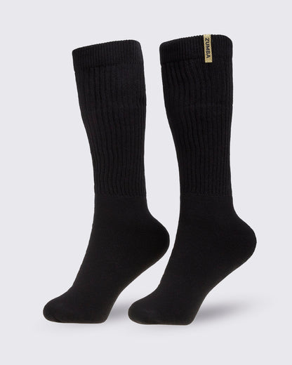 Pair of black socks with a brand Zumba logo in gold, on a white background.