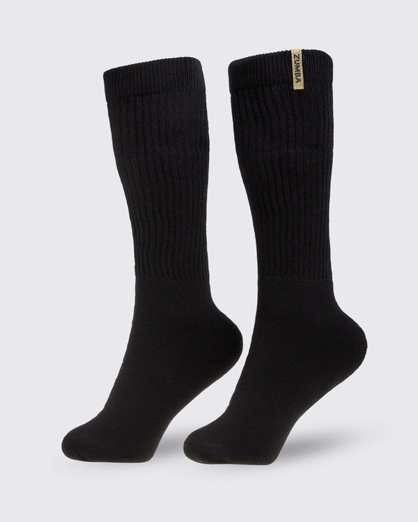 Pair of black socks with a brand Zumba logo in gold, on a white background.