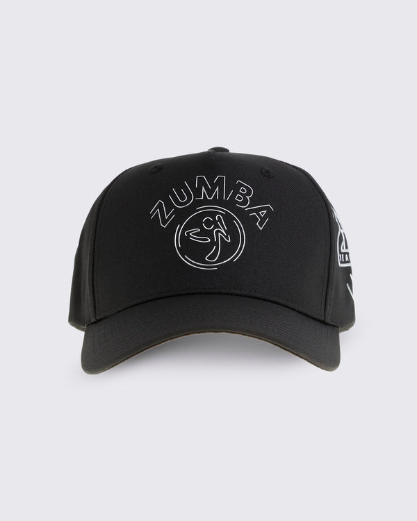 Black baseball cap with curved brim, silver Zumba logo on the front, and a silver 25 Years graphic on the side, shown from the front against a light gray background.