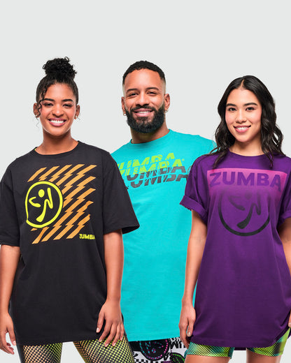 Three models wearing T-shirts in black (female), aqua (male), and purple, (female), each with a different "ZUMBA" graphic print.