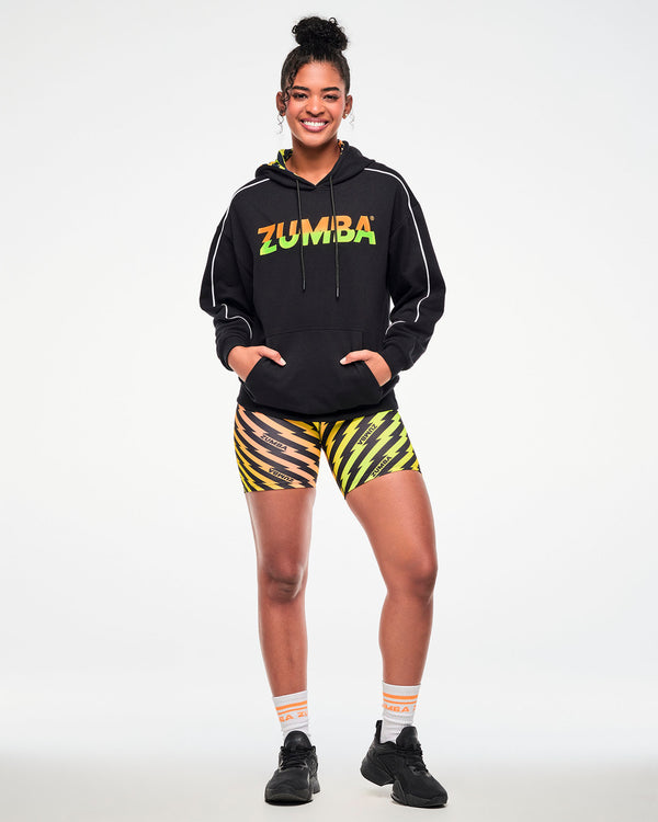 Full view of a female model wearing a black hoodie with 