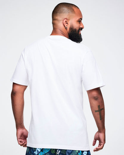 Back view of a male model wearing a white Zumba t-shirt on a plain background.