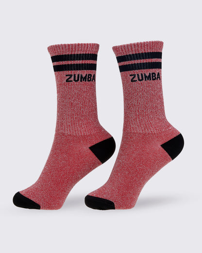 A pair of red high socks with black stripes and black toe and heel sections, 'ZUMBA' printed in black on the upper cuff and the sparkling lurex threads seen all-over the red pattern of the sock.