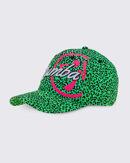 A green and black leopard print baseball cap, from the left side, featuring a large embroidered 'Zumba' logo in white with a pink Zumbito on the front, set against a white background.