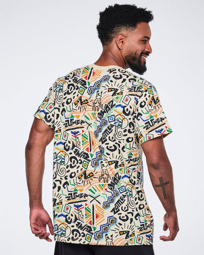 Back view of a cream short-sleeve graphic T-shirt with a crew neckline, relaxed fit, and allover multicolor abstract print. Male model wears the T-shirt with black pants.