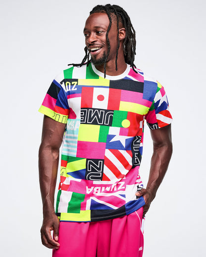 Male model wearing a colorful graphic t-shirt with various flag designs on a white background.
