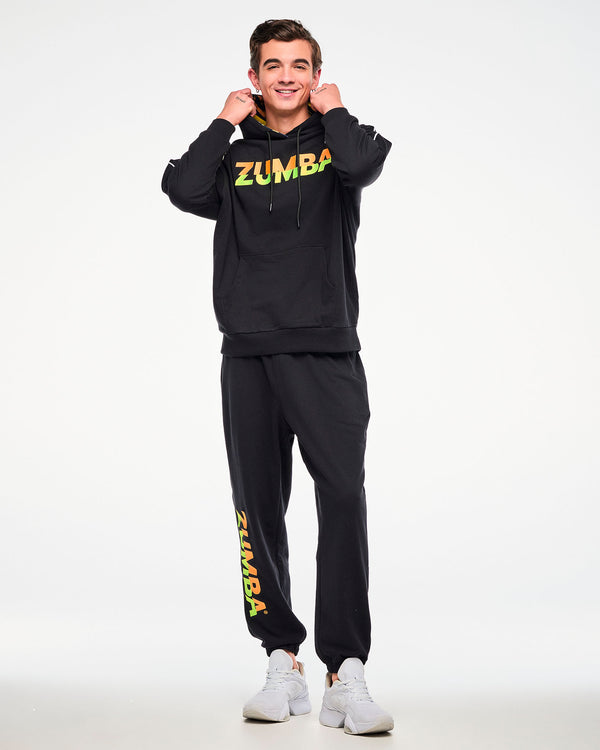Male model wearing a black hoodie and matching joggers with a gradient 