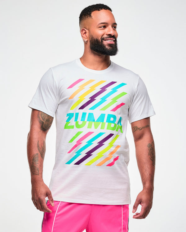 Male model wearing a white tee with a colorful lightning bolt-striped print, and aqua and green 