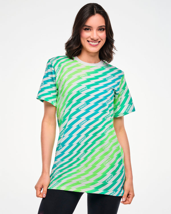 Female model wearing a green and aqua lightning bolt-striped tee with repeated 
