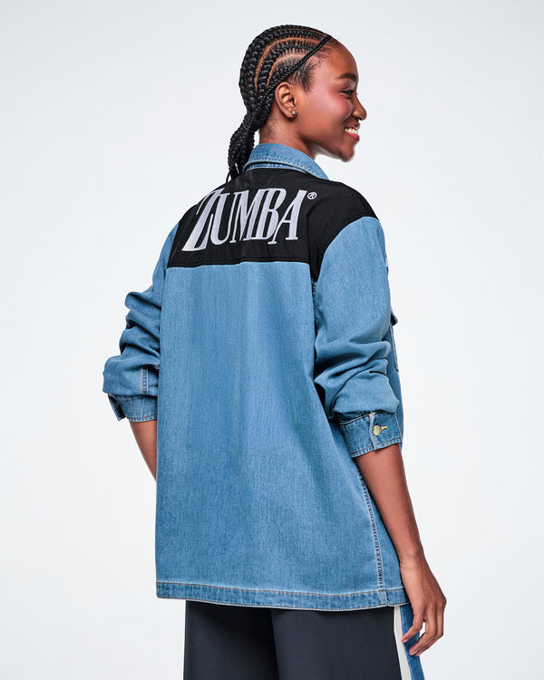 Back view of a female model wearing a denim shacket with a black yoke featuring white 